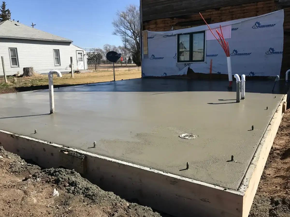 Finished concrete slab with utility penetrations