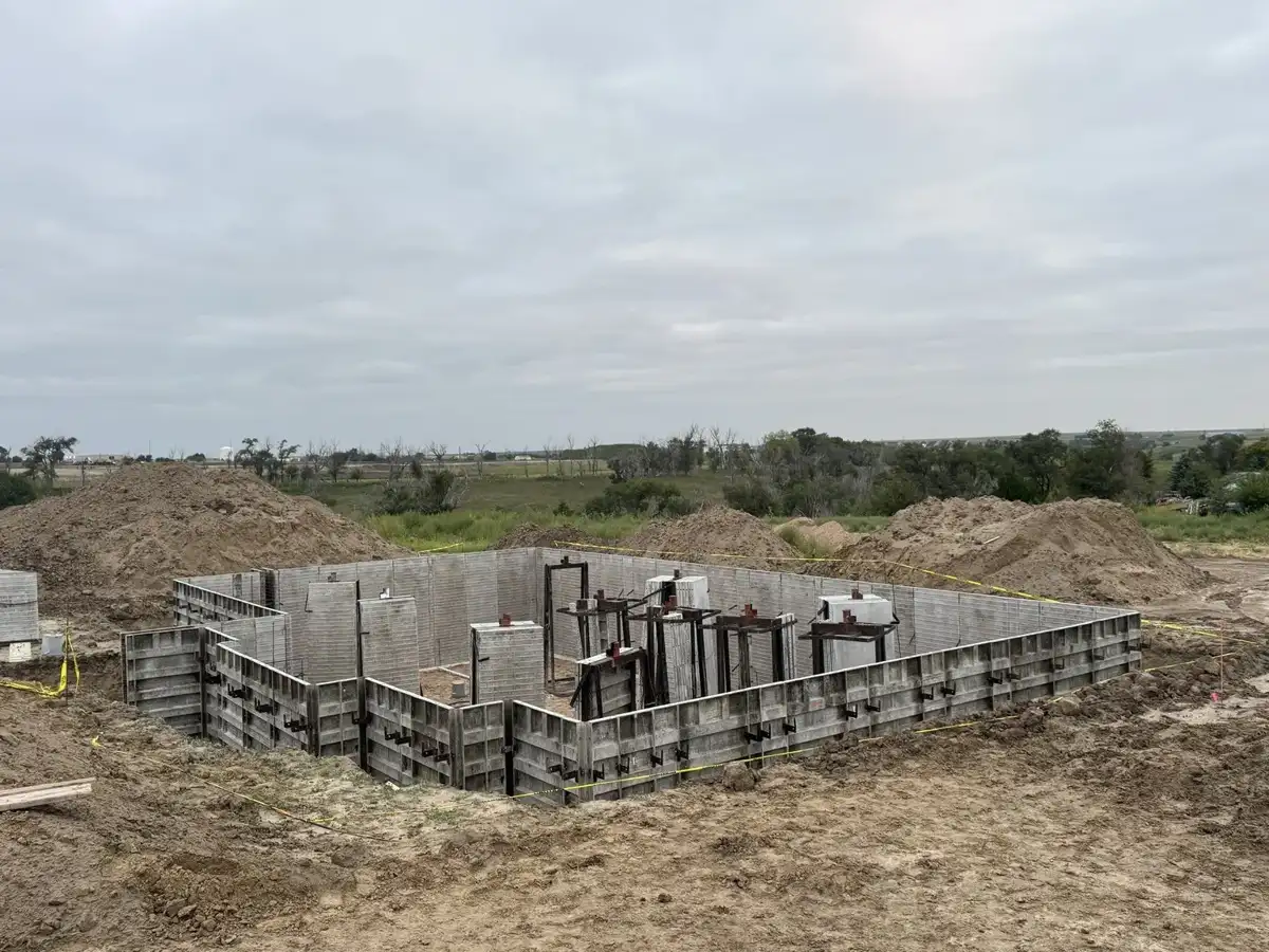 Wide view of foundation wall forms within the excavation