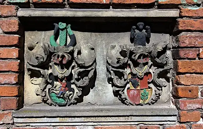 Historic carved coat-of-arms plaque