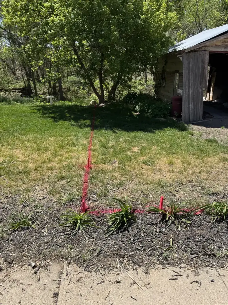 Marked lines and corner locations guide the next stage of site work.