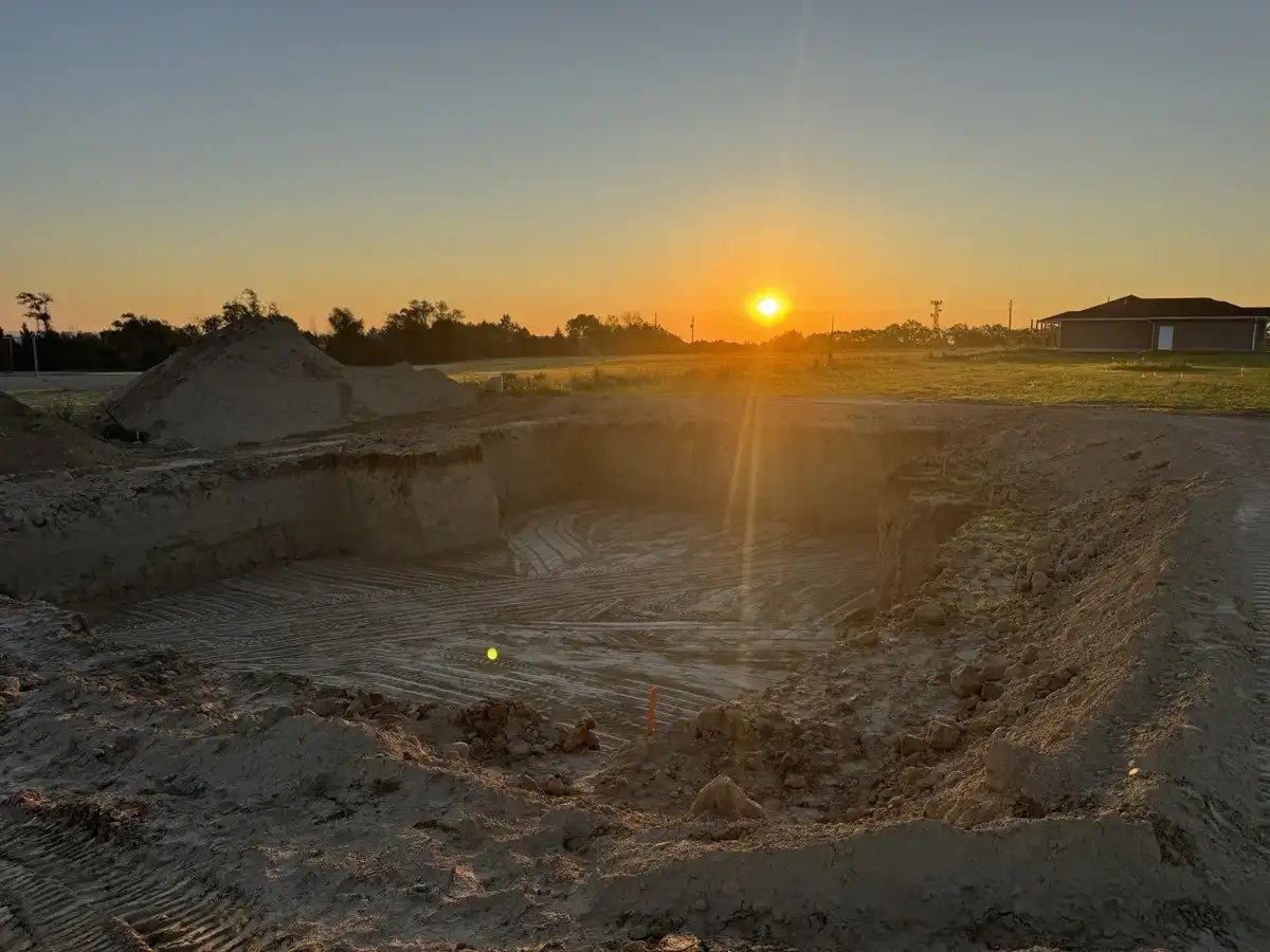 Building excavation at sunset