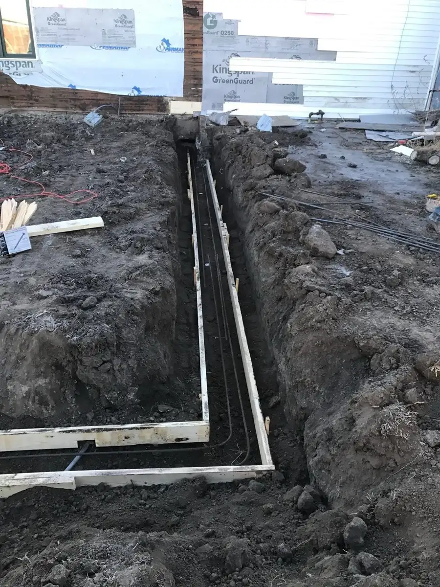 Corner footing forms in an excavated trench