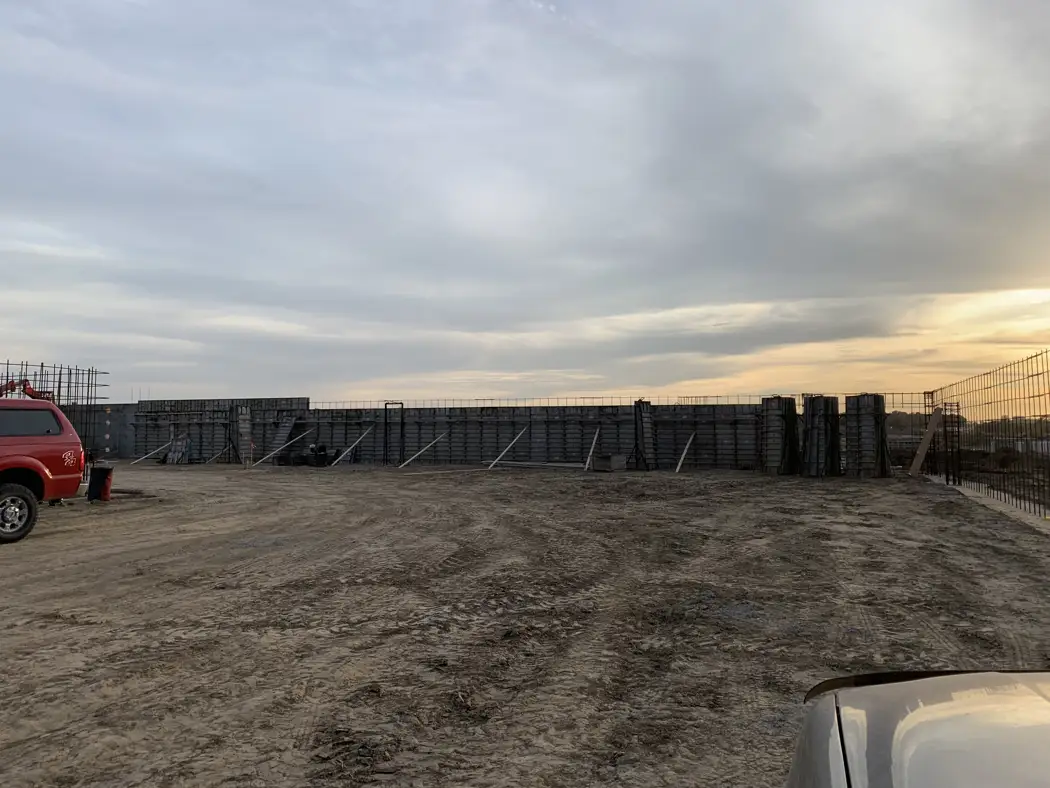 Braced formwork outlines the foundation walls ahead of the next construction stage.