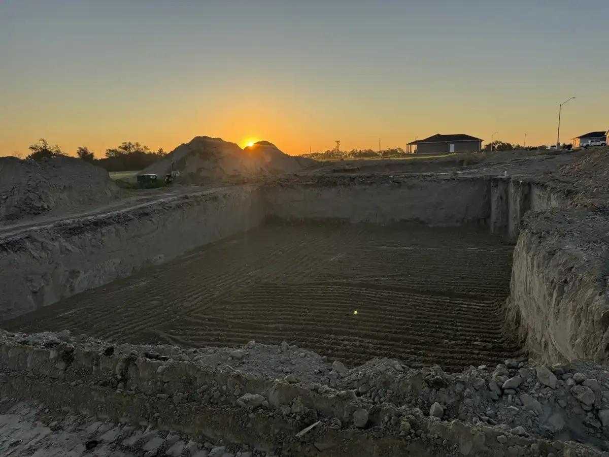 Excavated basement at sunset