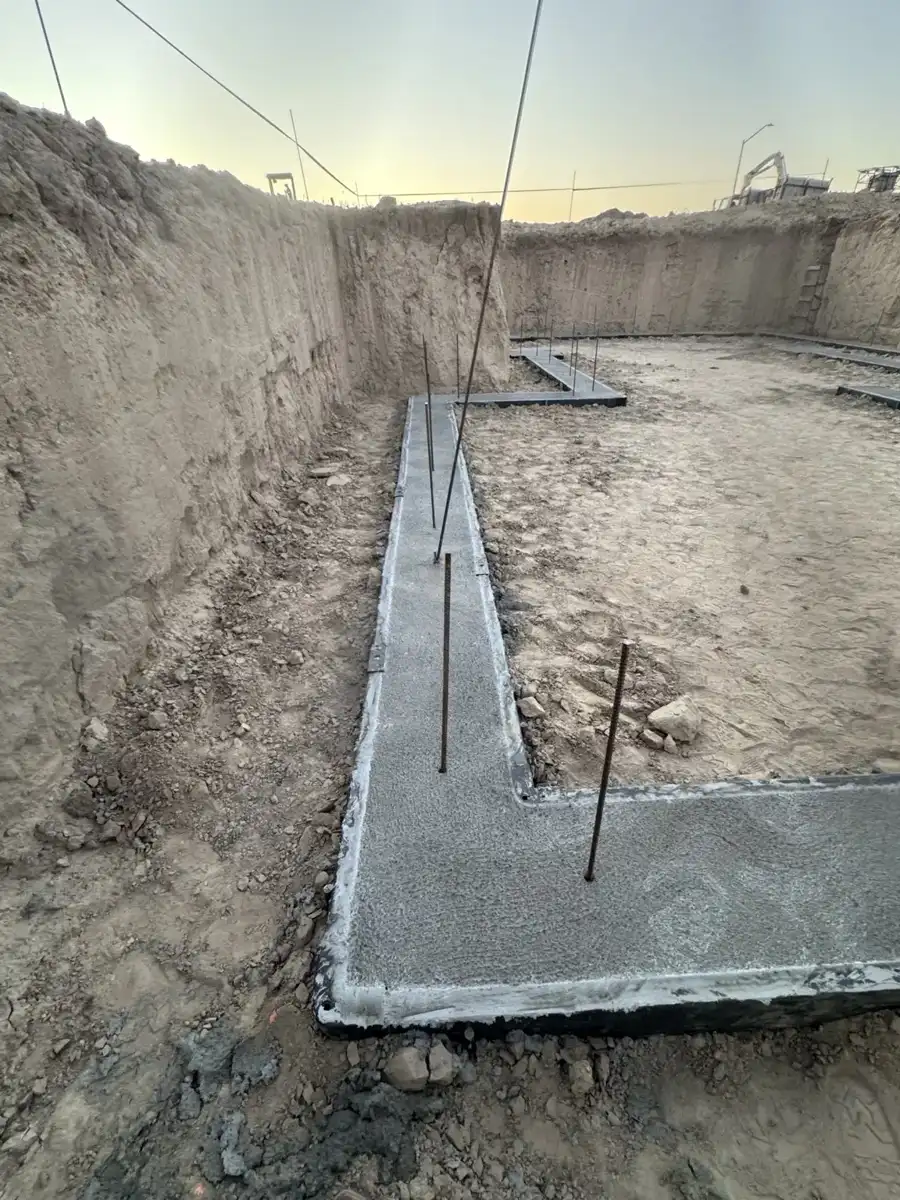 Concrete footing with vertical reinforcing bars