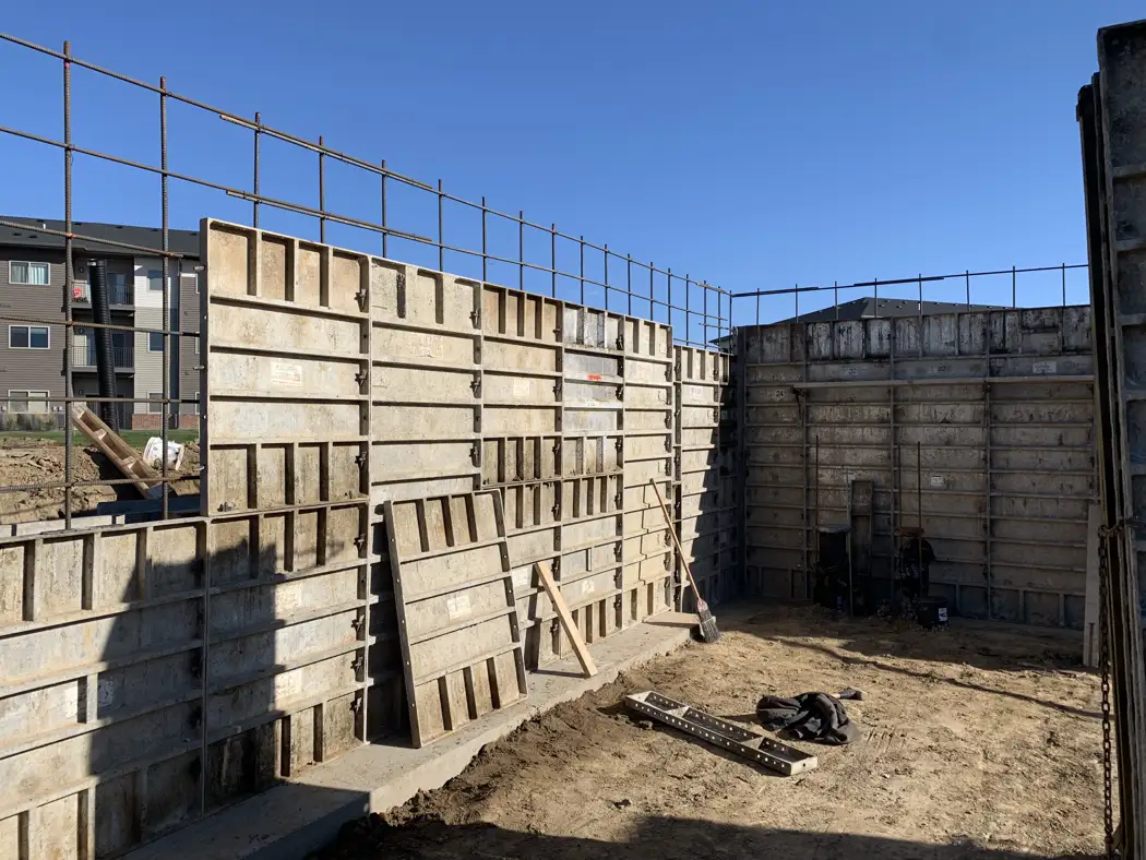 Intersecting form panels establish the layout of the poured concrete walls.