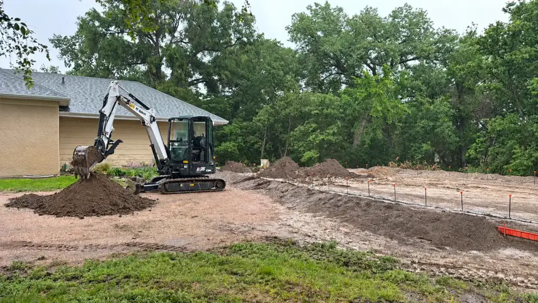 Excavation progresses across the marked site as groundwork begins.