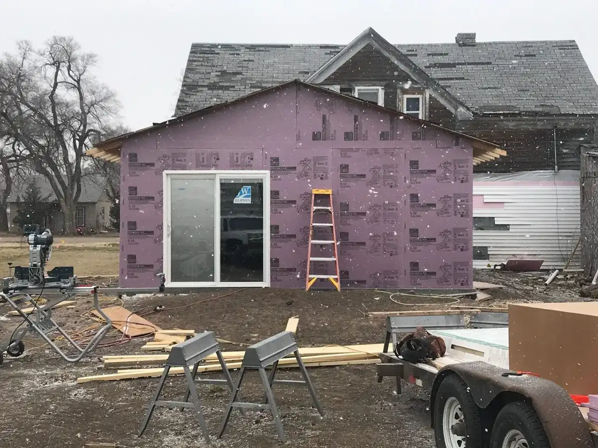 Insulated exterior walls and sliding door installation